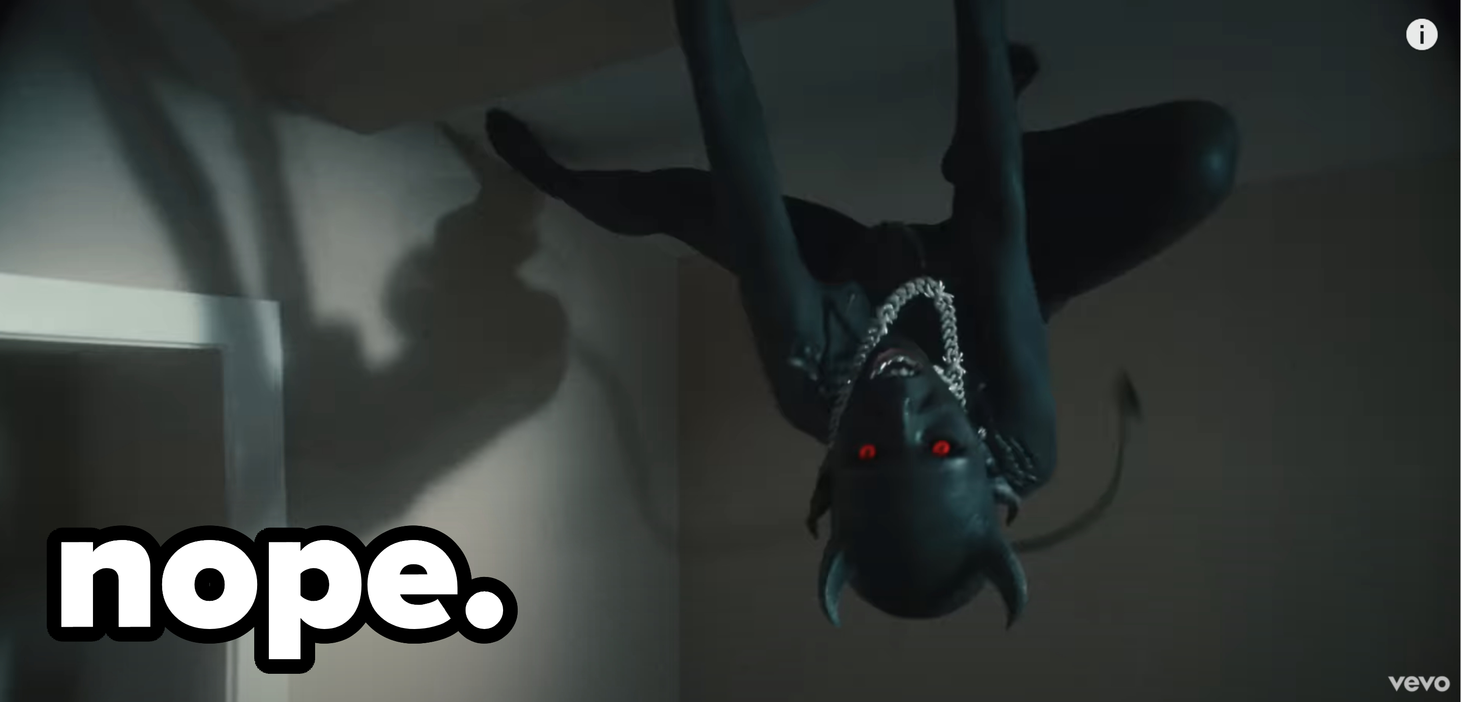 &quot;Demon&quot; Doja with red eyes climbing on the ceiling with caption &quot;Nope&quot;
