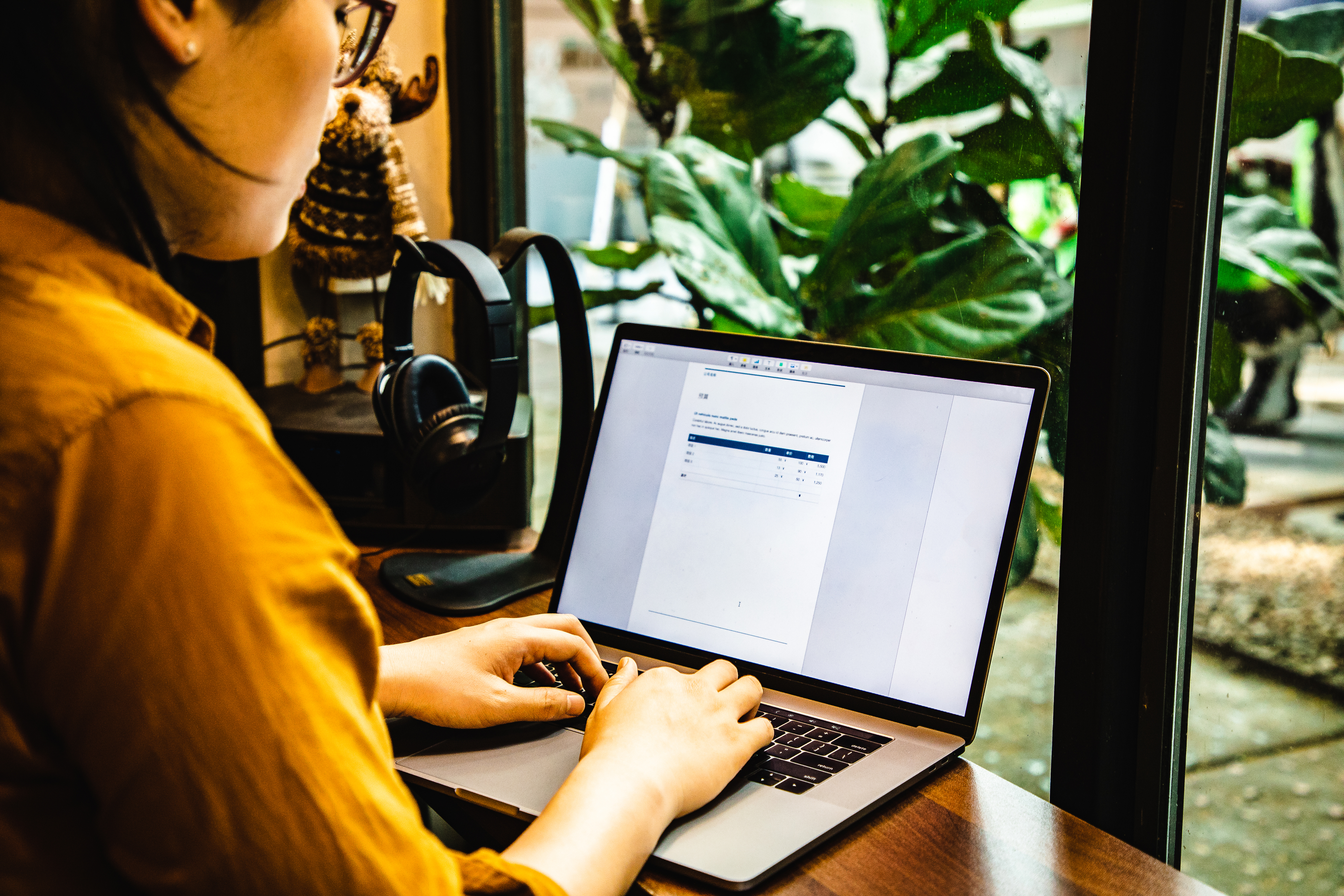 woman typing on a laptop