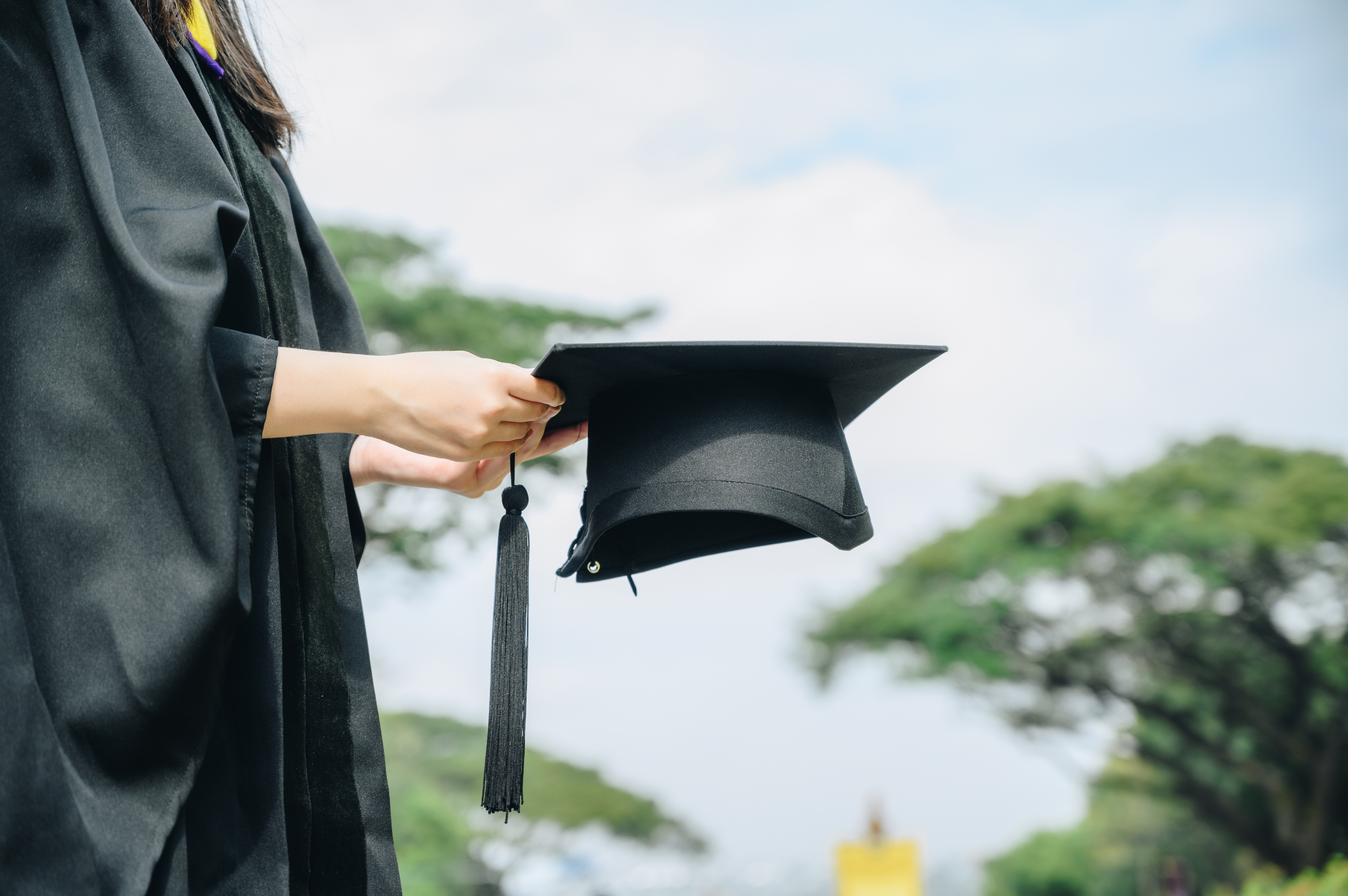 person wearing a graduation cap and gown