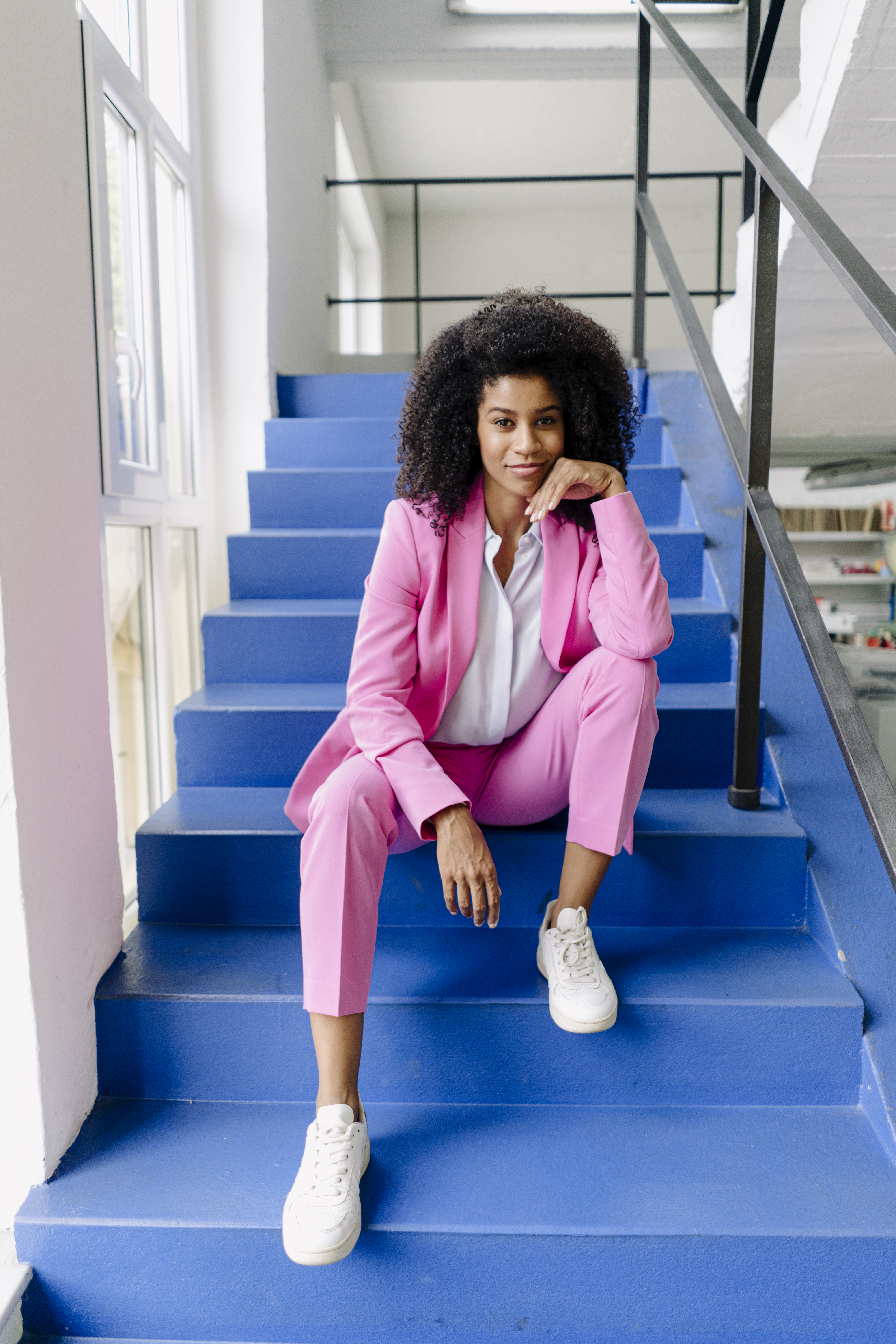 woman wearing a cute barbiecore pantsuit