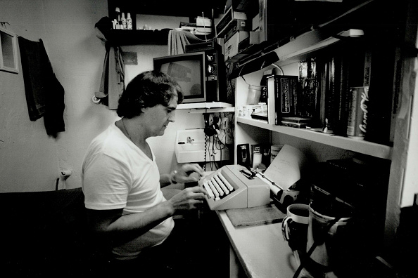 someone writing on a typewriter