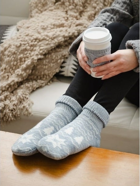 Slippers and a coffee cup with a sweater