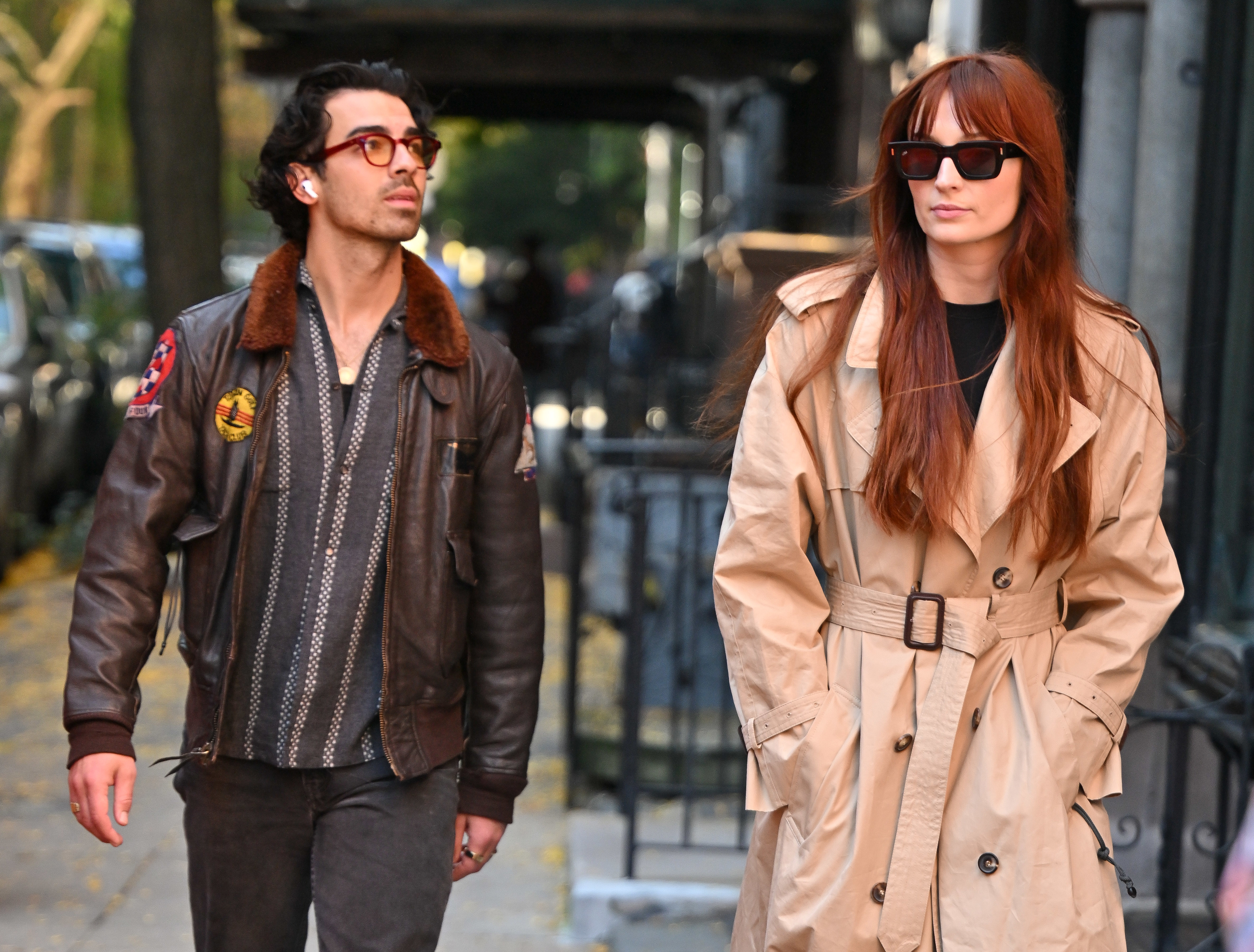 Joe and Sophie walking down a sidewalk