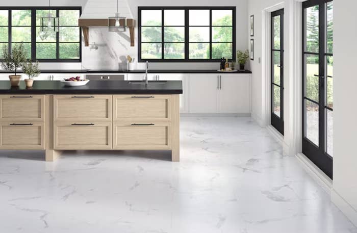 White marble pattern peel and stick tiles in a kitchen
