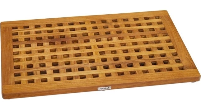 A teak wood bath mat