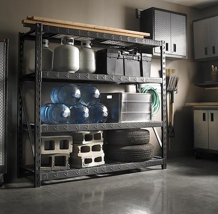 A large steel shelves with heavy items resting on it in a garage