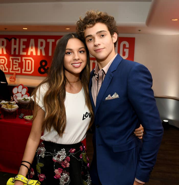 Oliva Rodrigo and Joshua Bassett pose for a photo with their arms around each other