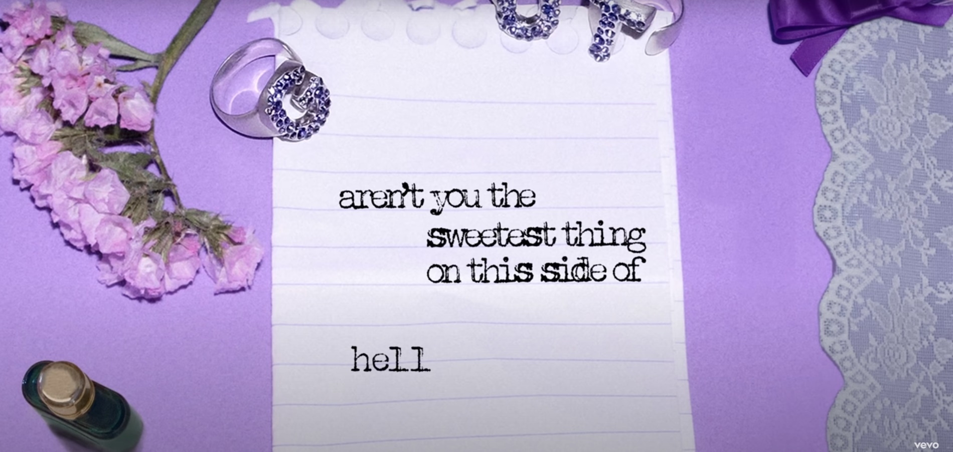 Screenshot of the lyric &quot;aren&#x27;t you the sweetest thing on this side of hell&quot; from the video