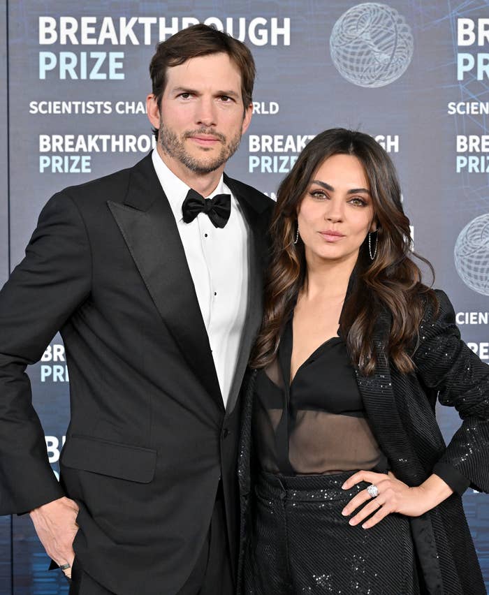 Close-up of Ashton and Mila at a media event