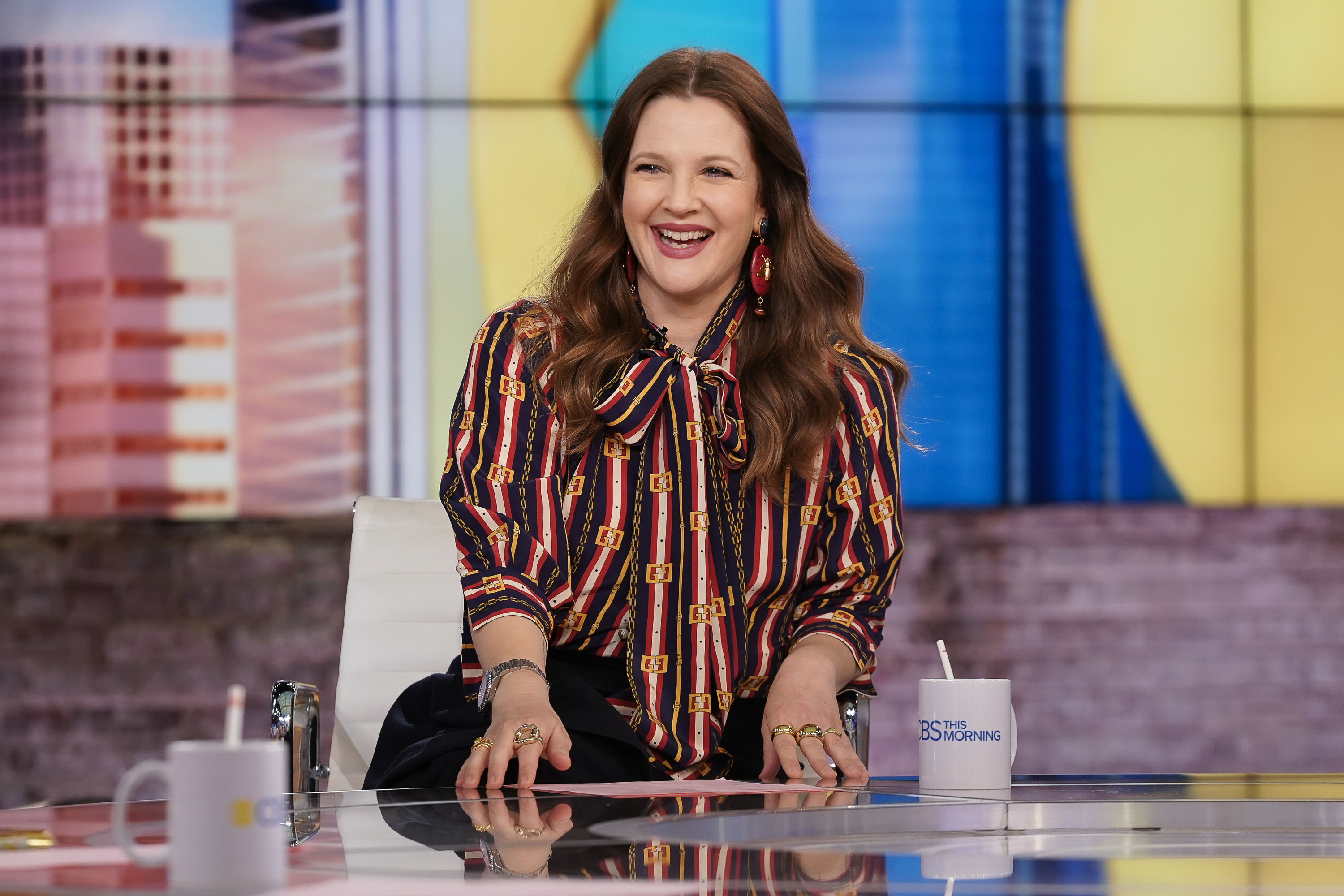 A close-up of Drew smiling on her talk show