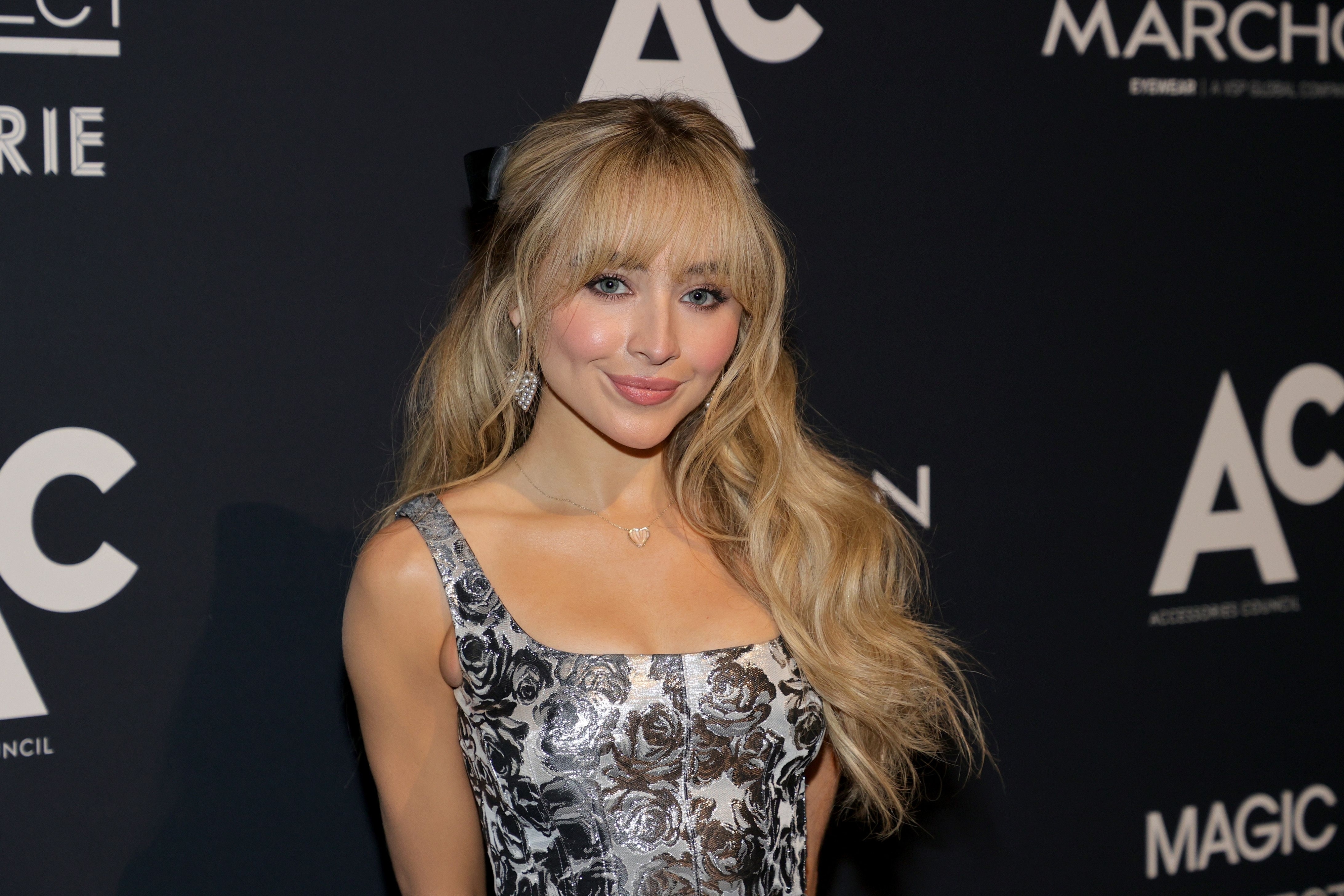 A close-up of Sabrina Carpenter on the red carpet in a brocade outfit