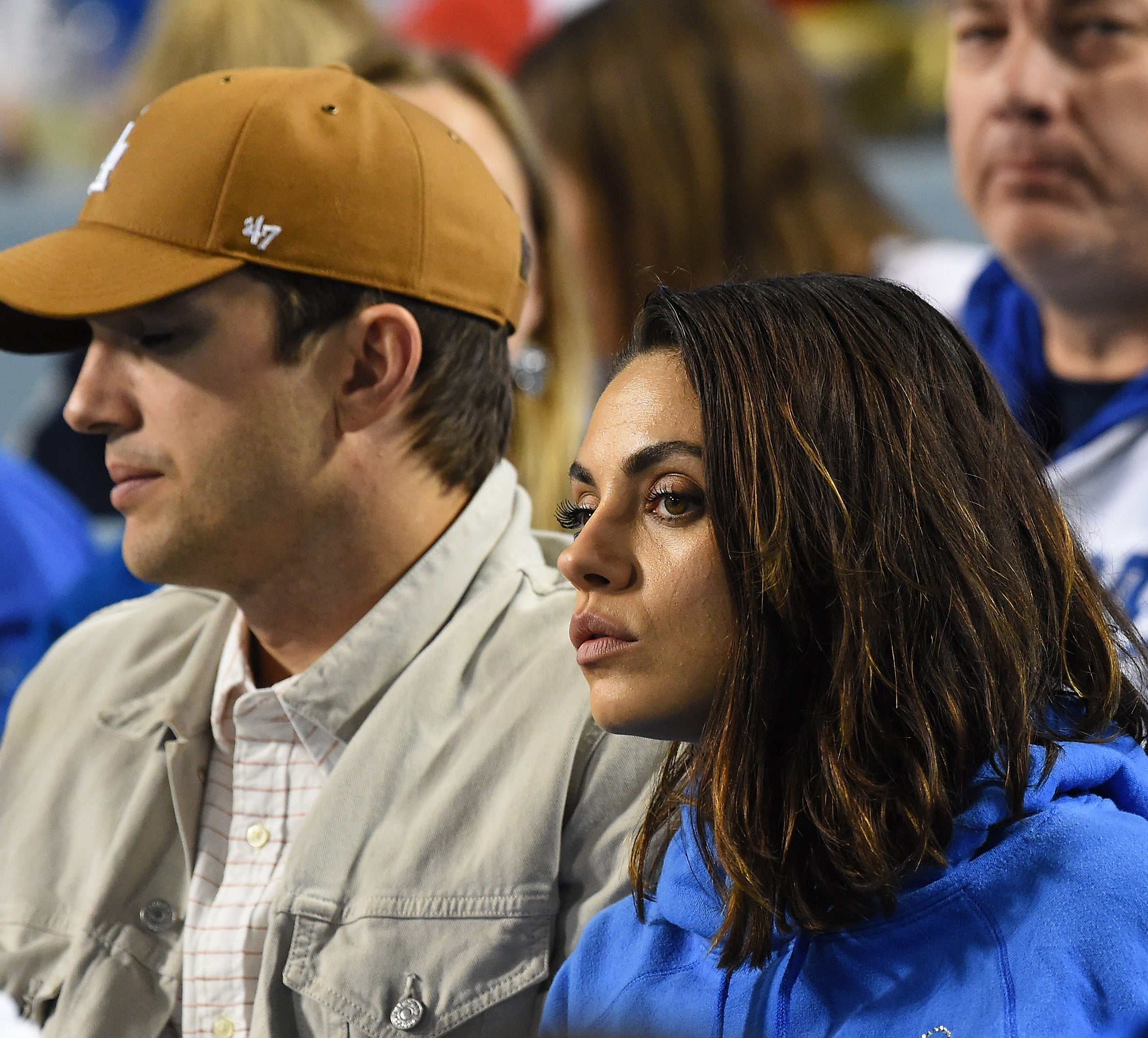 Close-up of Ashton and Mila sitting together