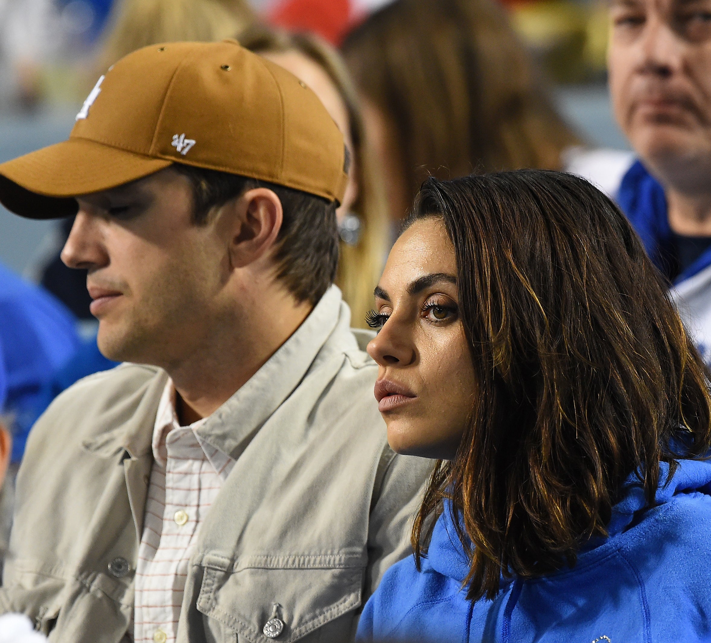 Close-up of Ashton and Mila sitting together
