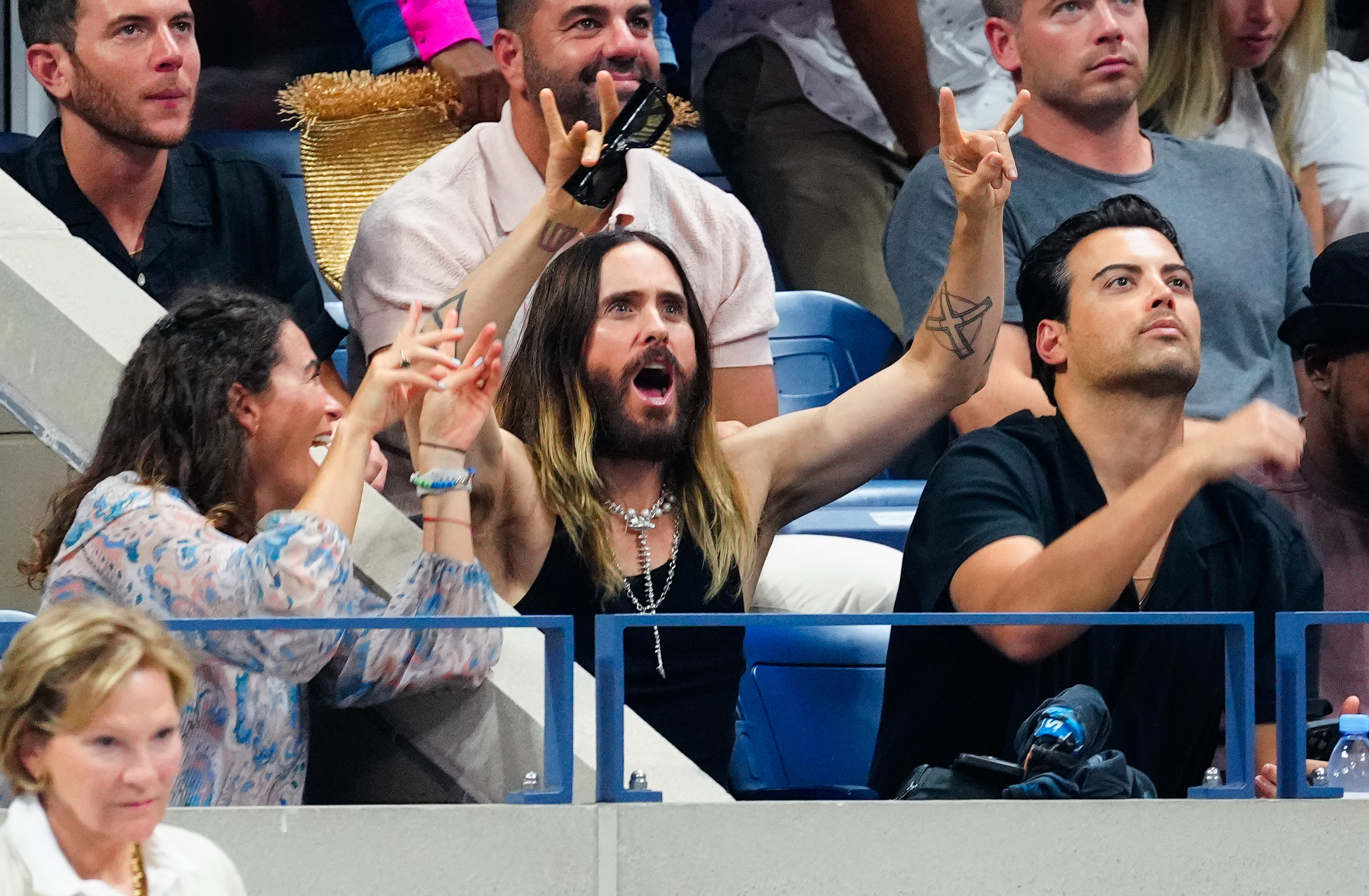 Jared Leto raises his arms