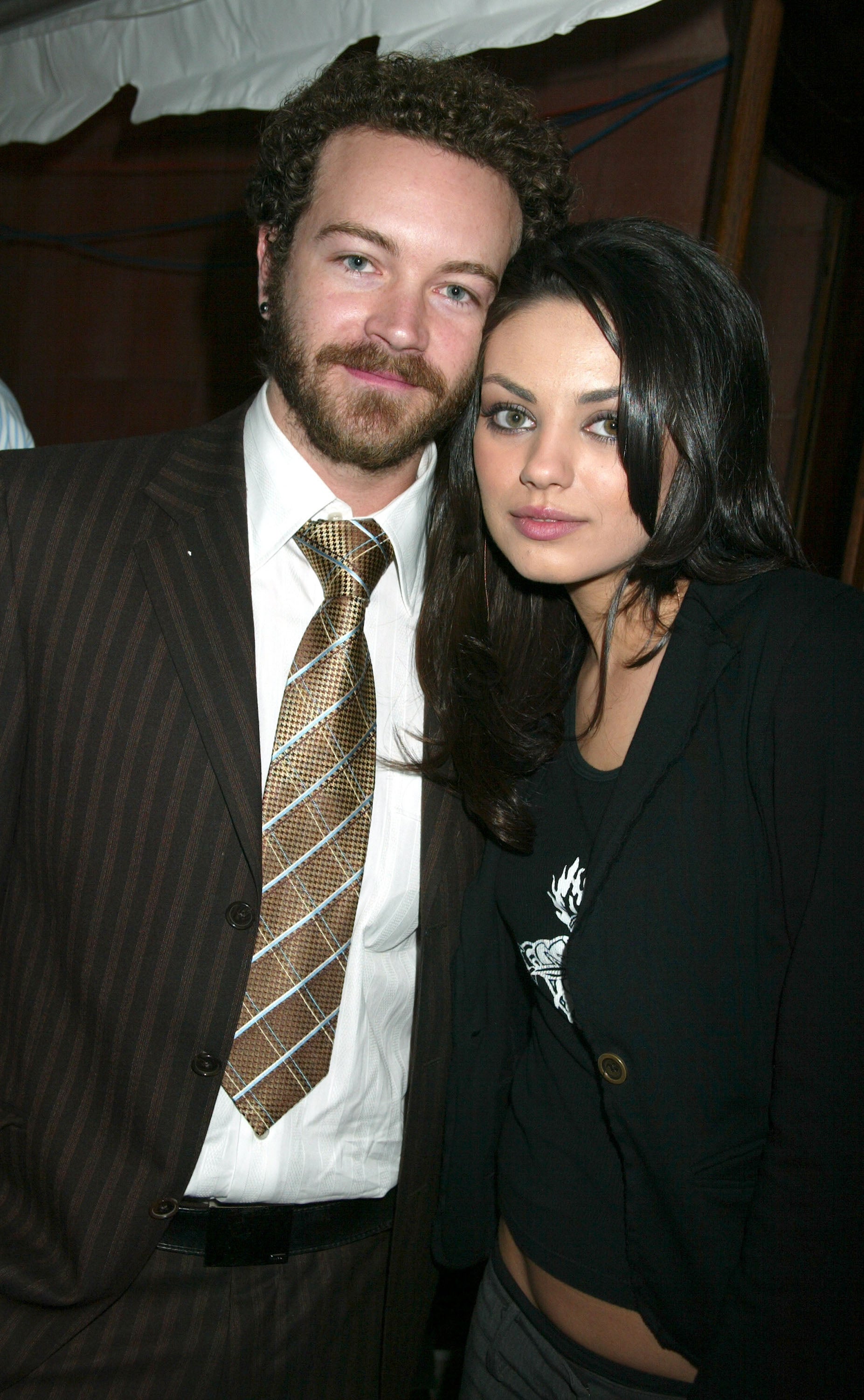 Close-up of Danny and Mila standing close together