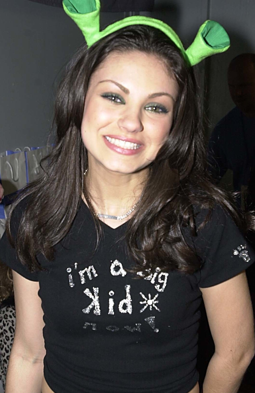 Close-up of Mila smiling and wearing a &quot;I&#x27;m a big kid&quot; T-shirt