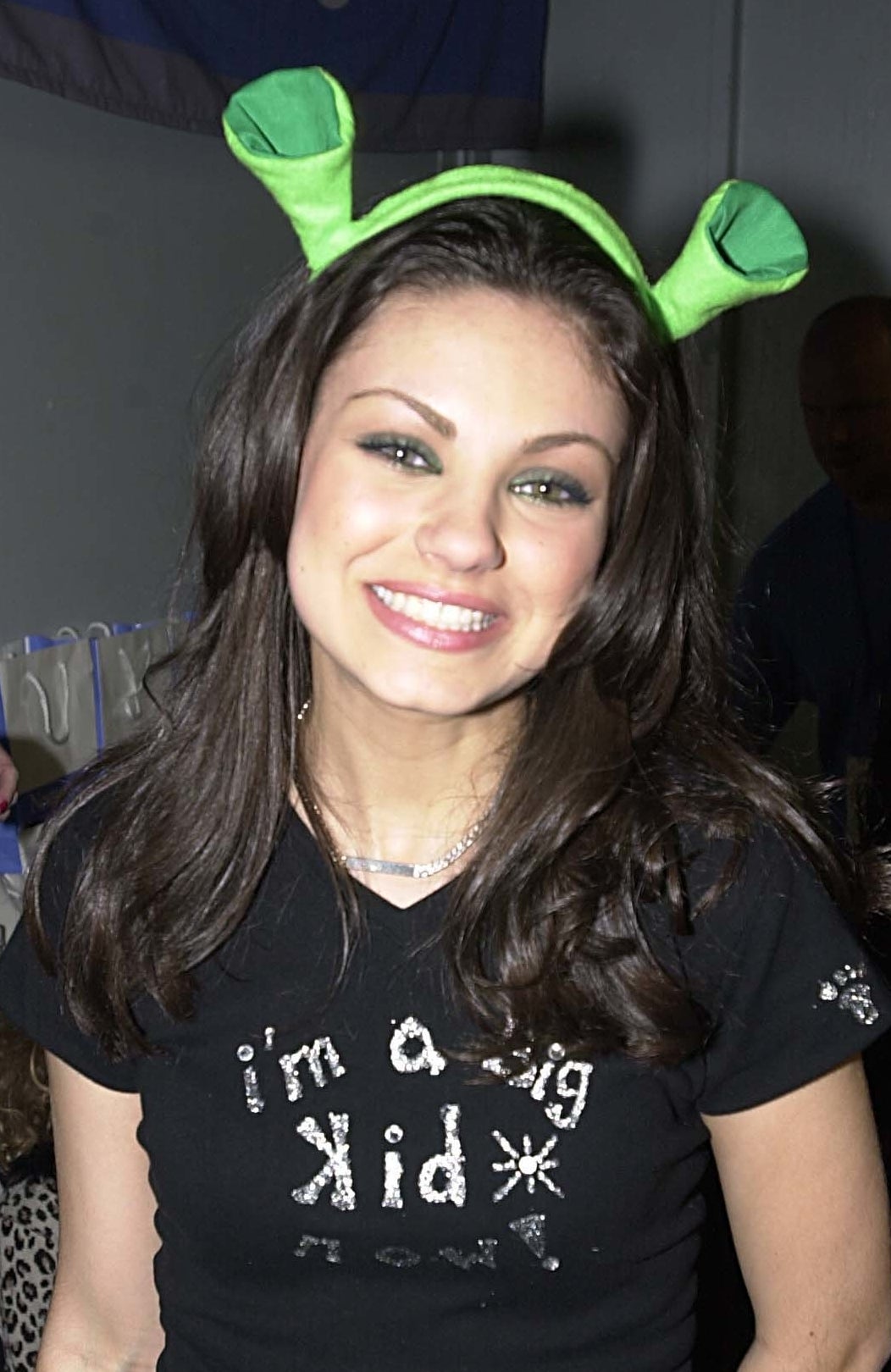 Mila wearing Shrek ears