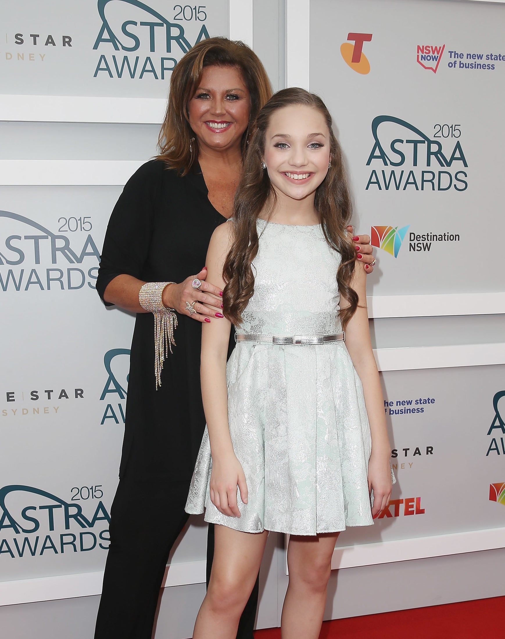 Close-up of Abby and Maddie smiling at a media event