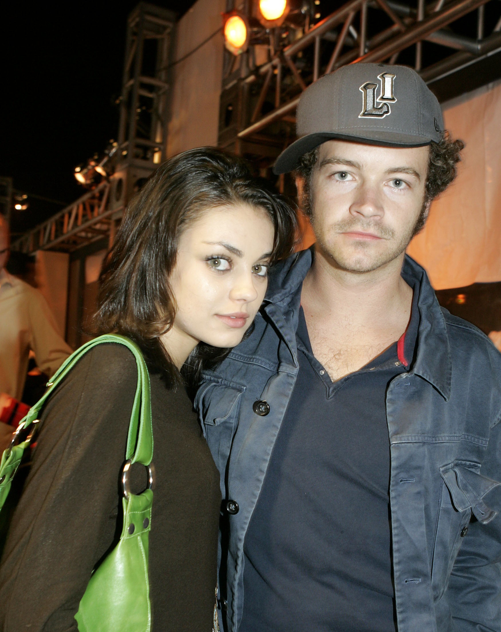 A younger Mila and Danny posing for a photo together