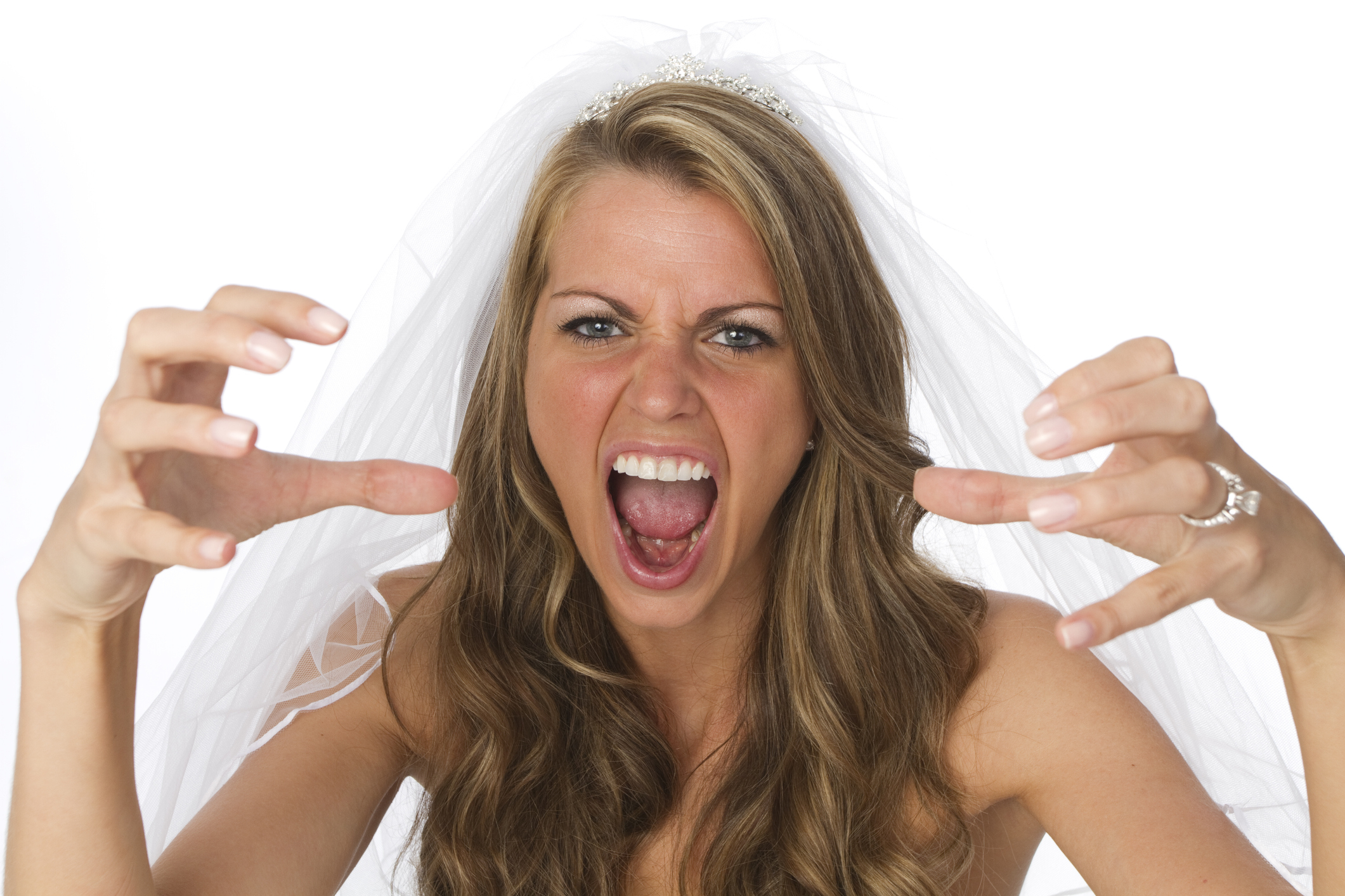A woman with a bridal veil looking angry