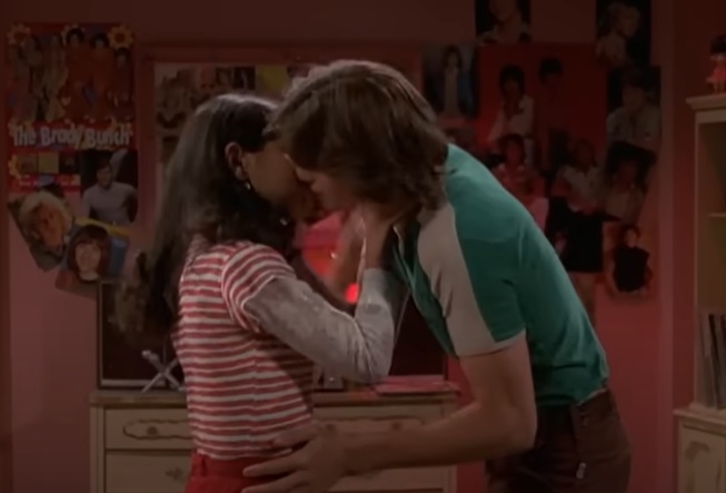 Mila and Ashton kissing in a scene from &quot;That &#x27;70s Show&quot;