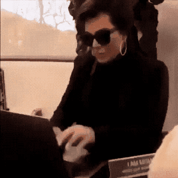 GIF of Kris Jenner trying to work her laptop