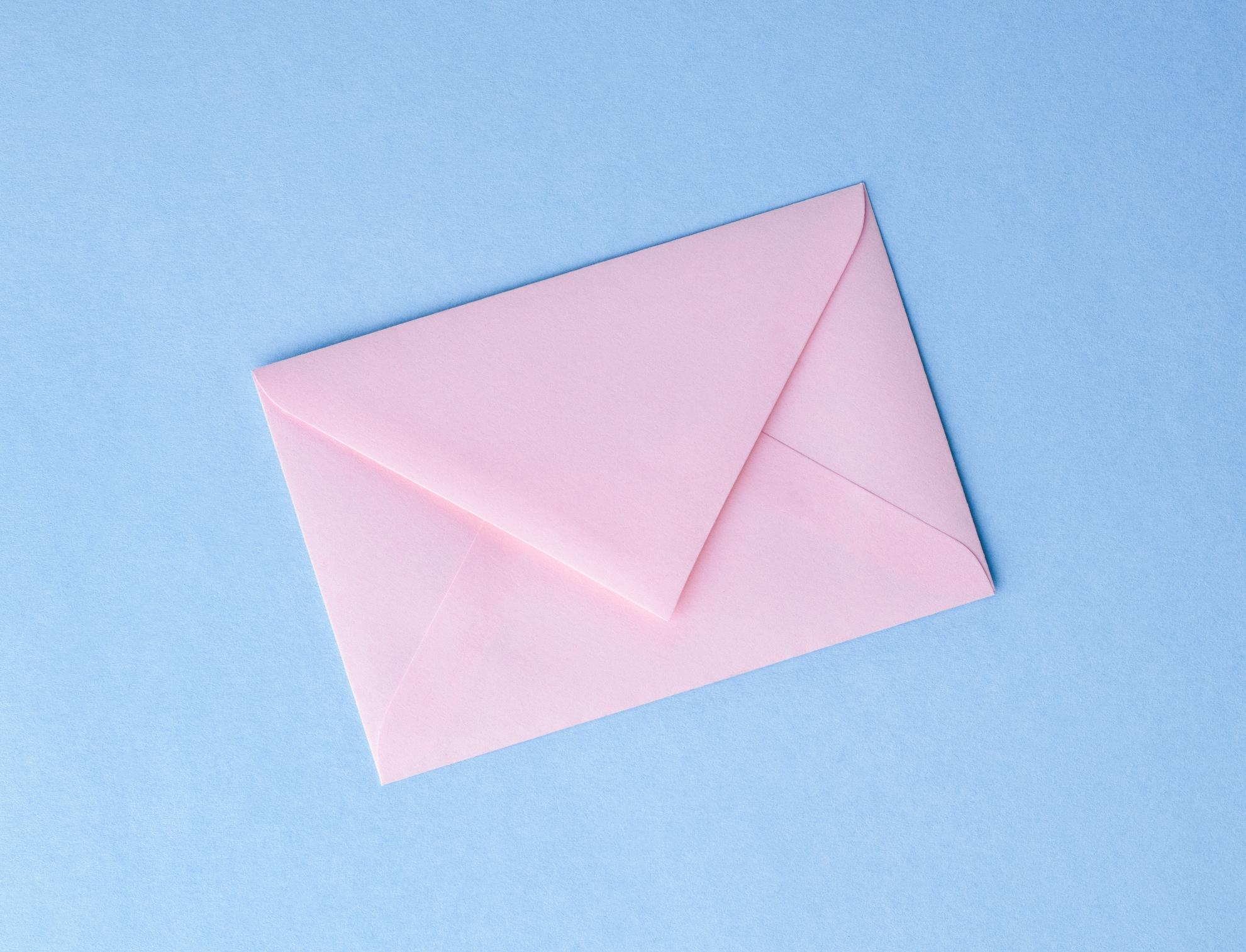 A pink envelope with a blue background
