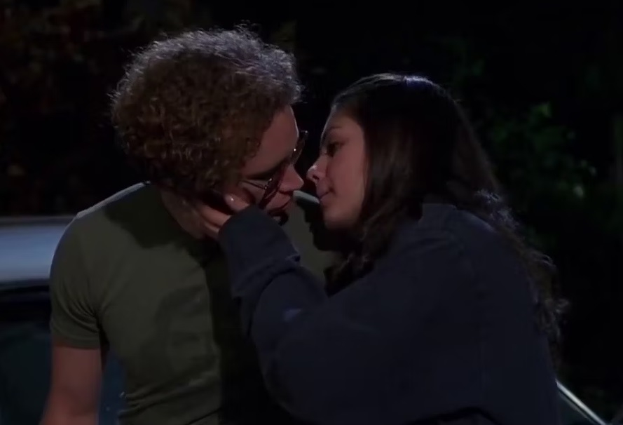 Mila and Danny going in for a kiss in a scene from &quot;That &#x27;70s Show&quot;