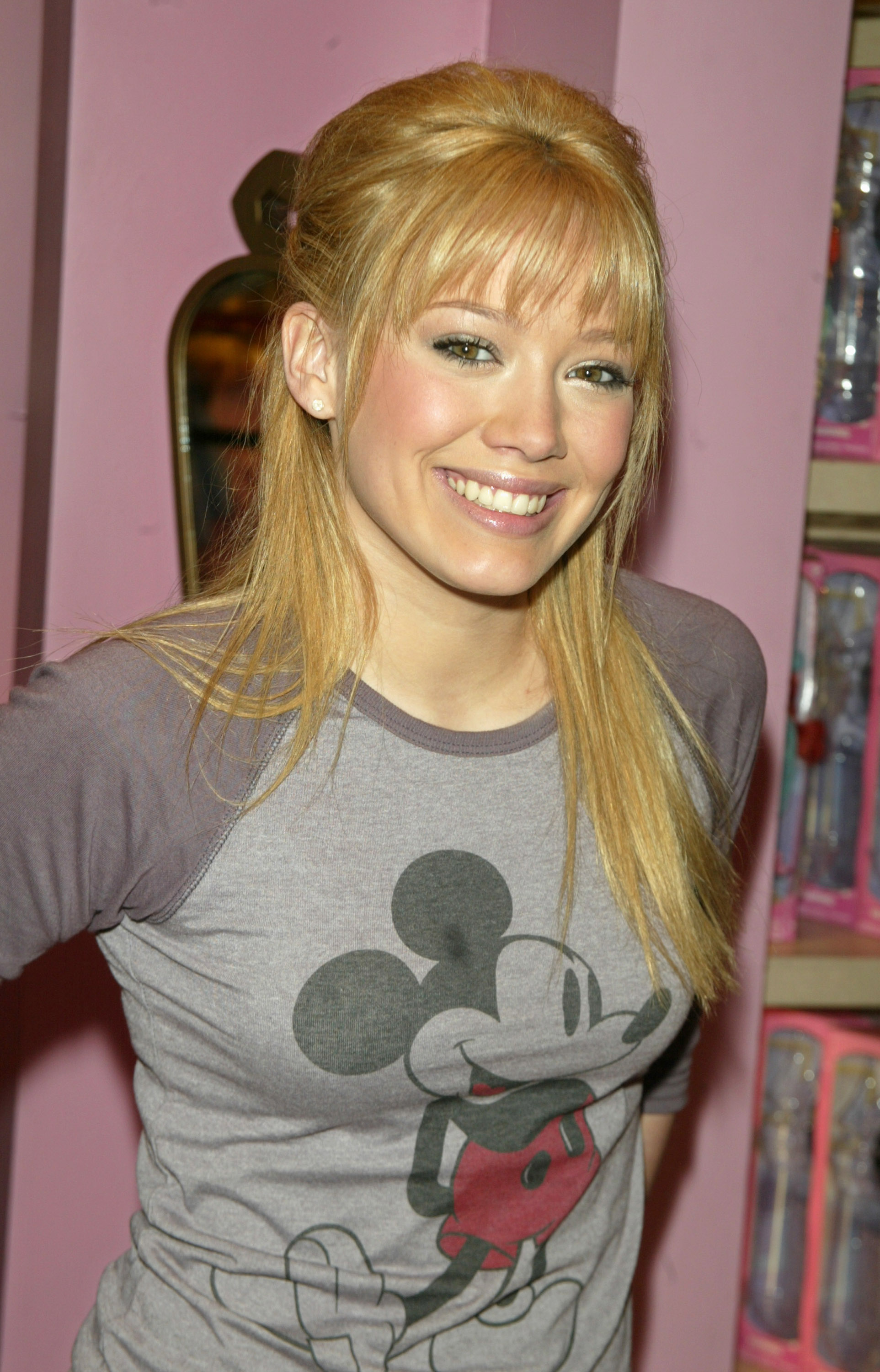 Close-up of Hilary smiling and wearing a Mickey Mouse T-shirt