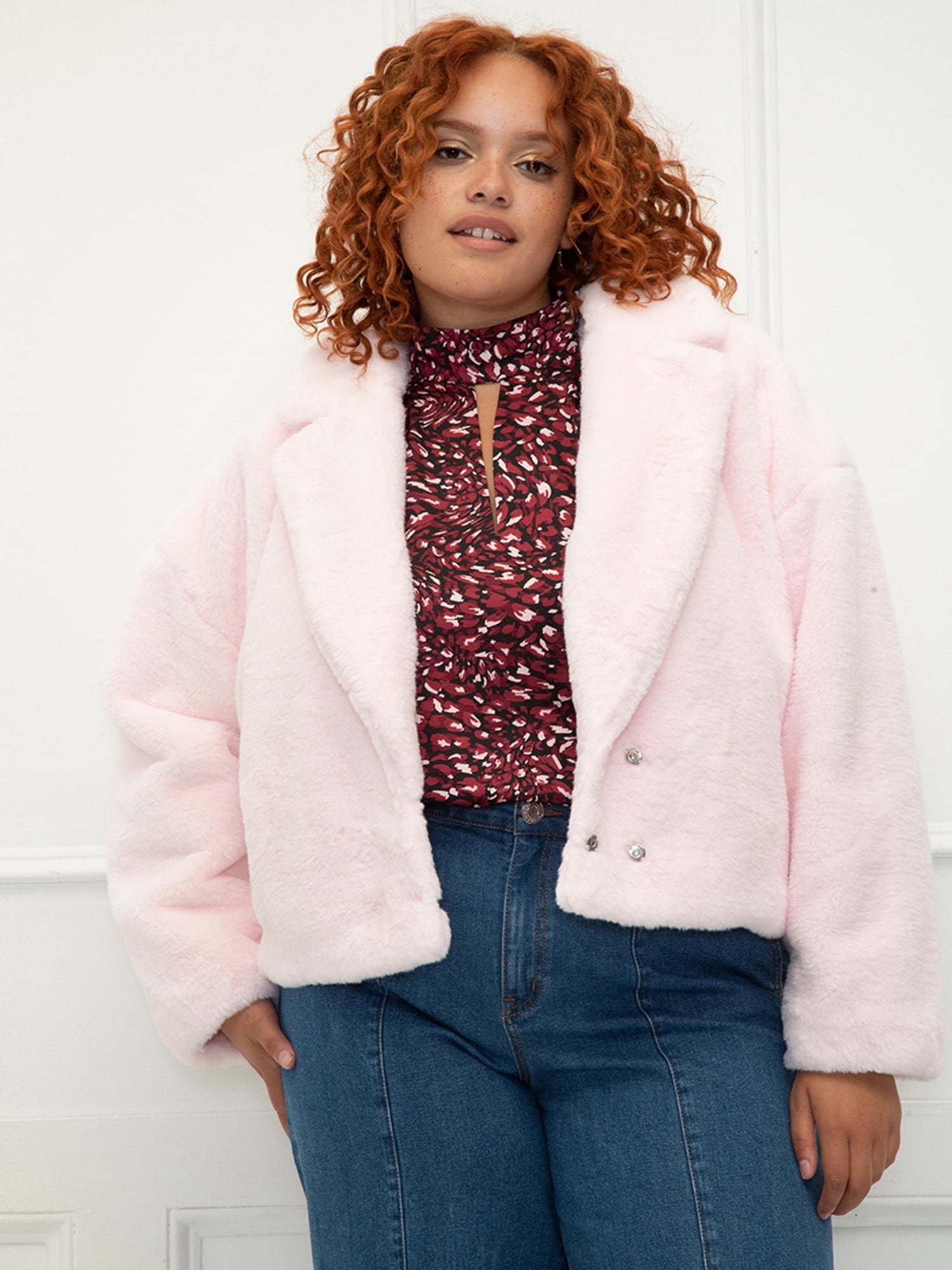 a model wearing the cropped faux jacket
