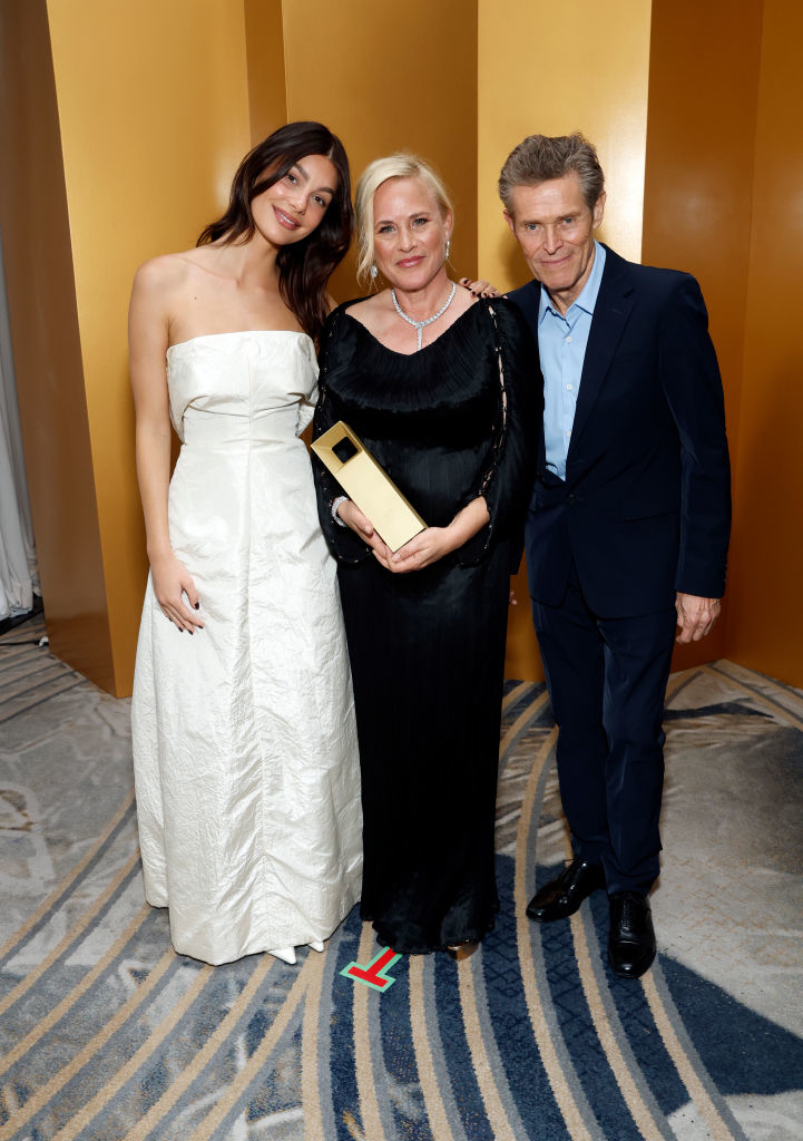 From left: Camila Morrone, Patricia Arquette and Willem Dafoe pose with an award.