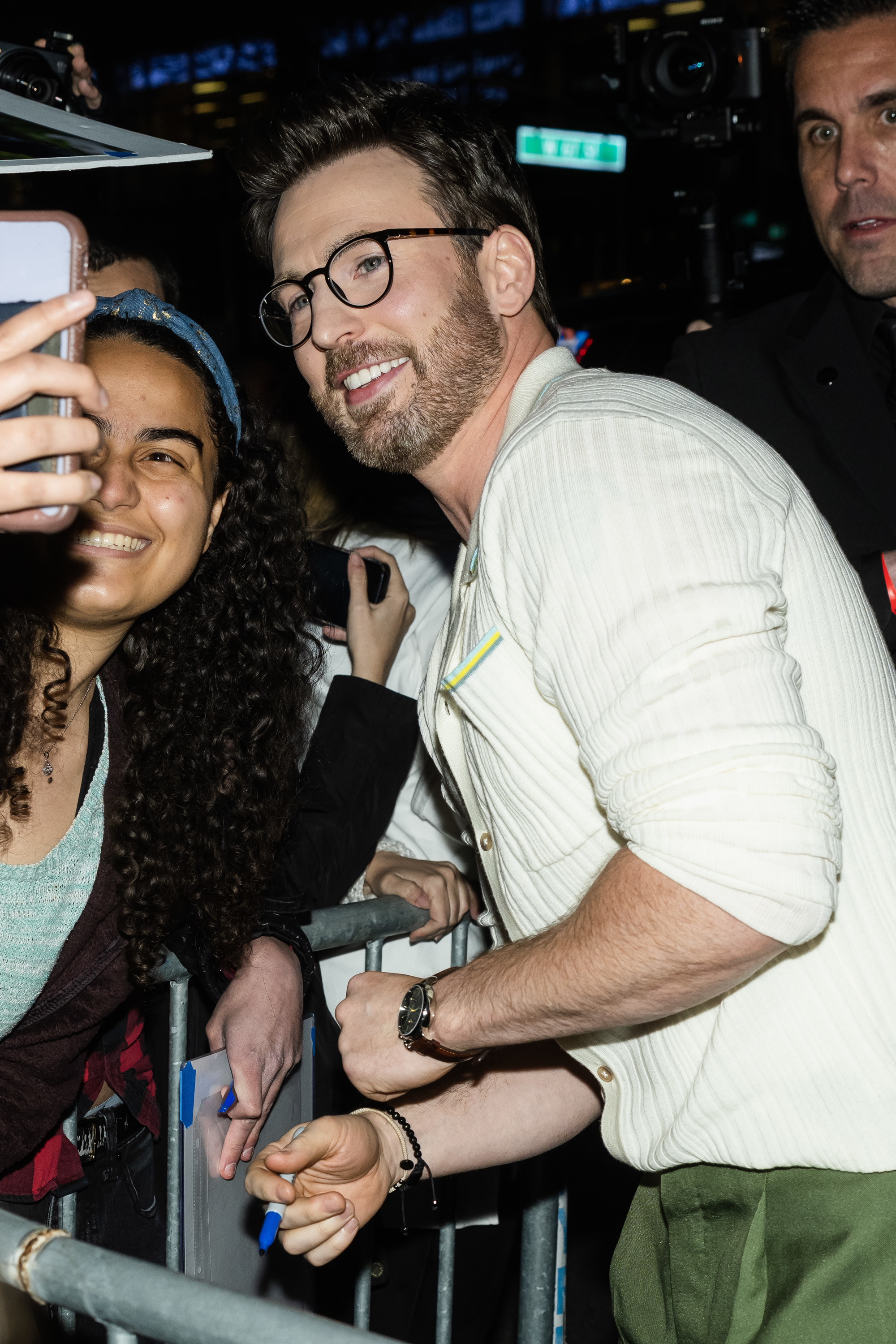 Chris taking a selfie with a fan