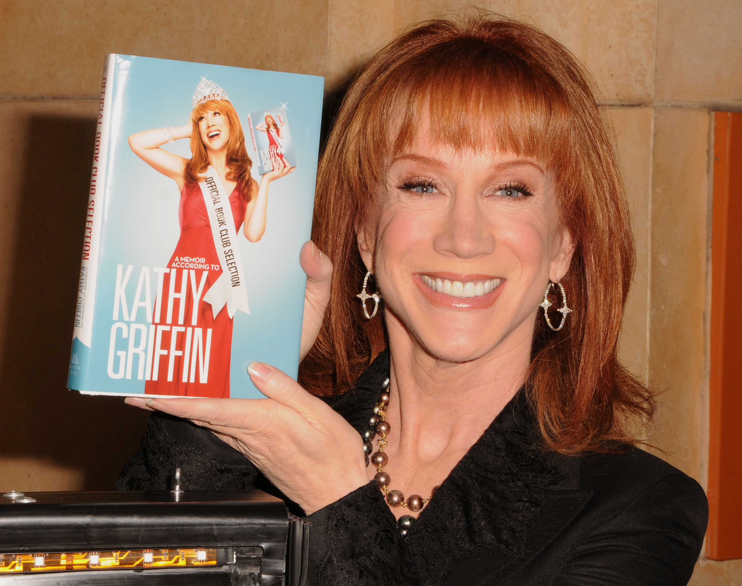 Kathy holding her book