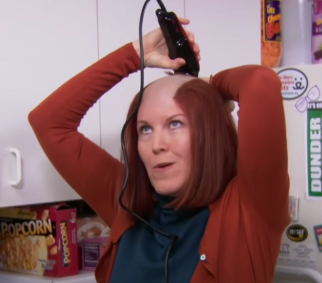 A woman shaving her head
