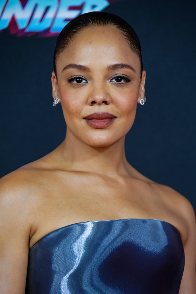 Close-up of Tessa at a media event in a strapless outfit