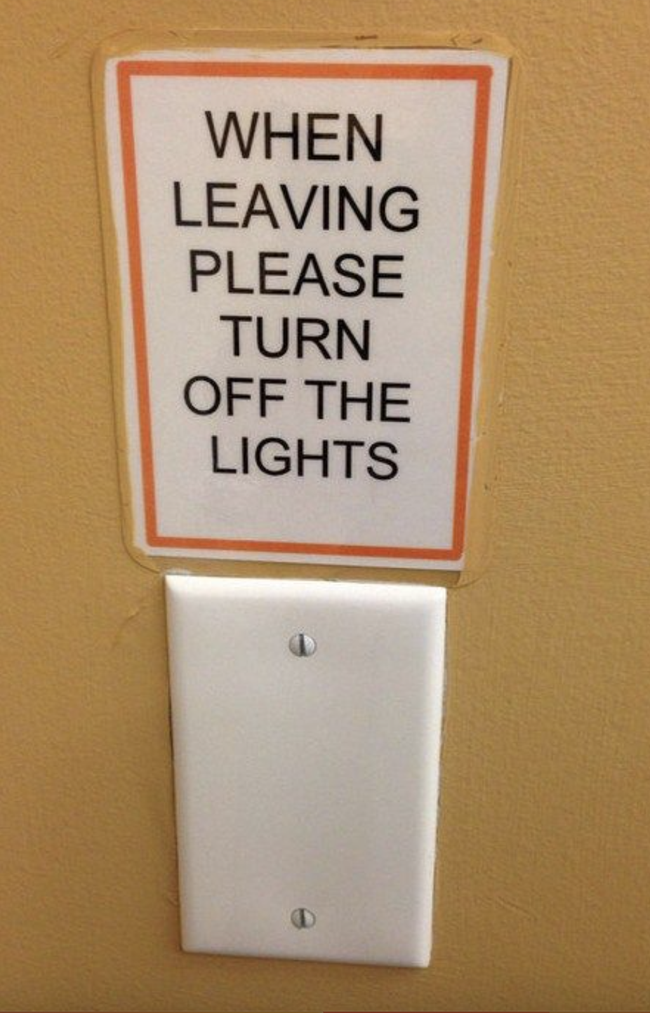 Sign: &quot;When leaving please turn off the lights&quot; with a flat plate where the switch should be