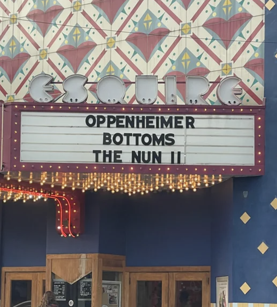 Three-line movie-theater awning: &quot;Oppenheimer / Bottoms / The Nun II&quot;