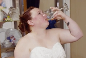 bride finishing her wine