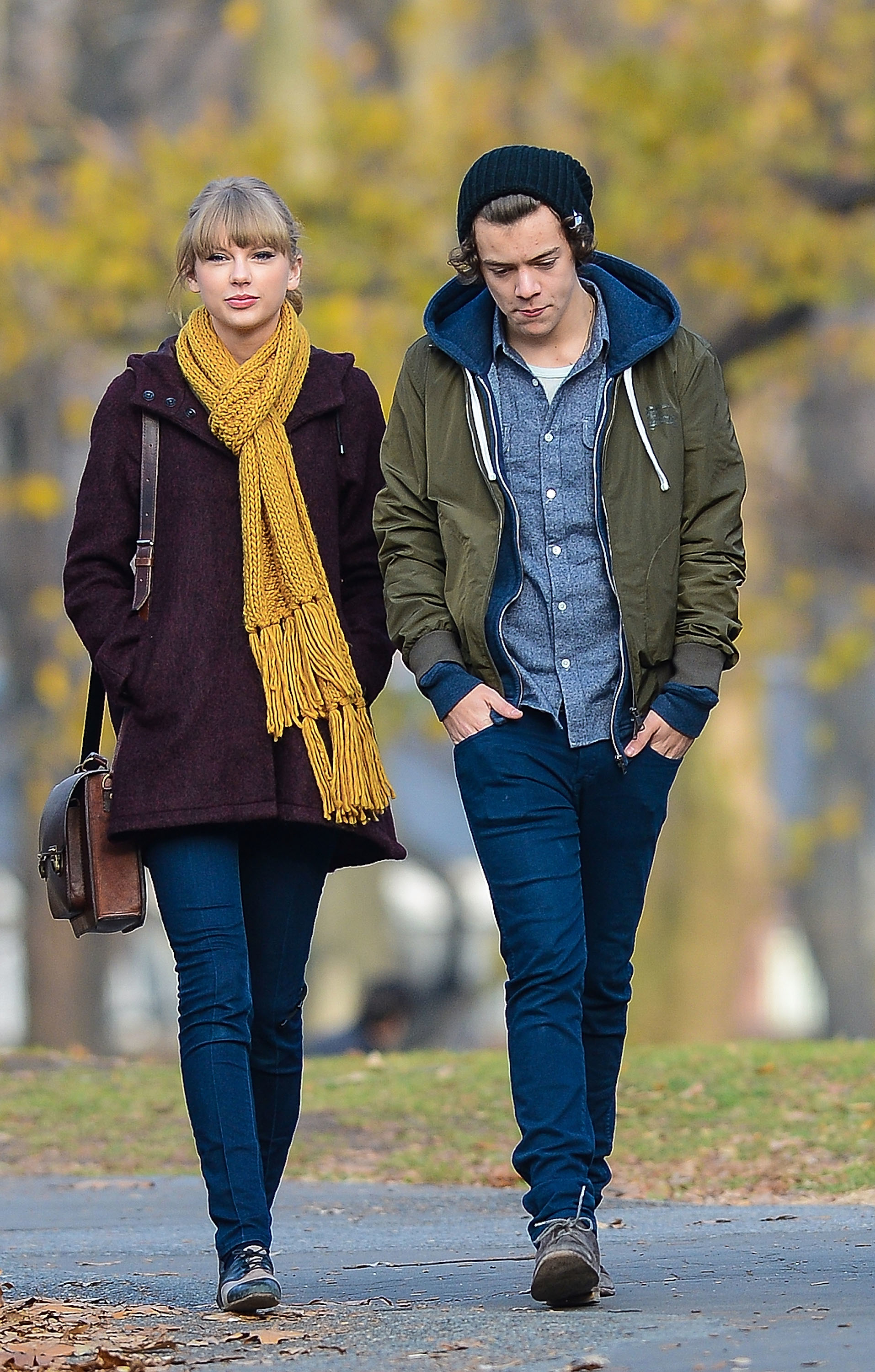 taylor walking outside with harry