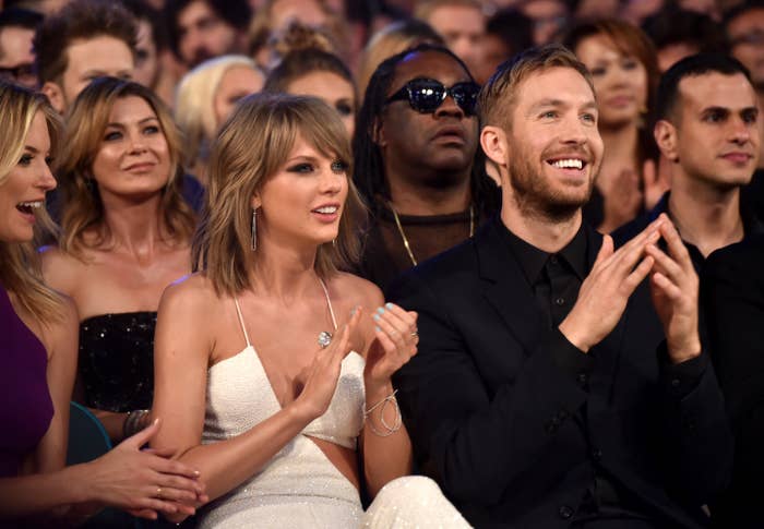 taylor sitting in the audience with calvin harris