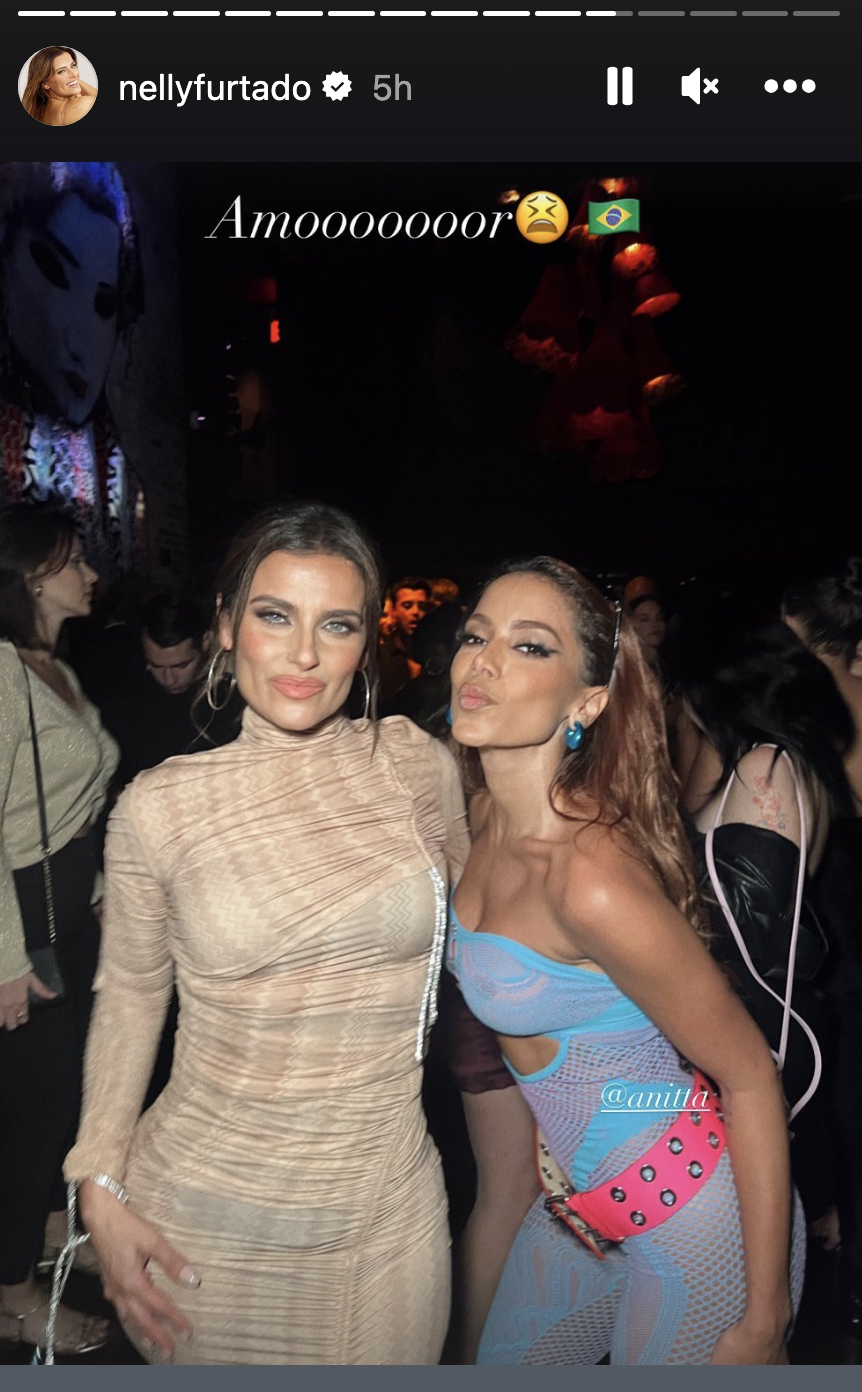 nelly wearing a tight dress and annita in a mesh strapless onesie and large belt