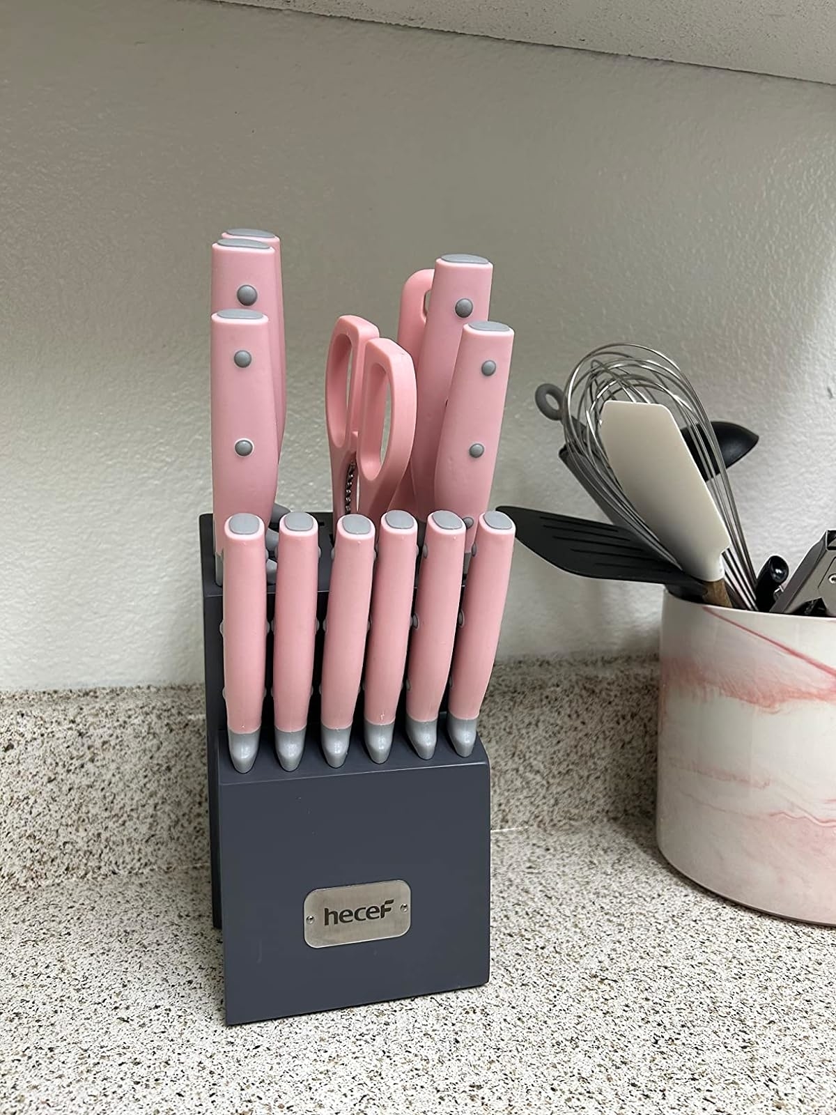 Reviewer image of the pink knife block set on their countertop