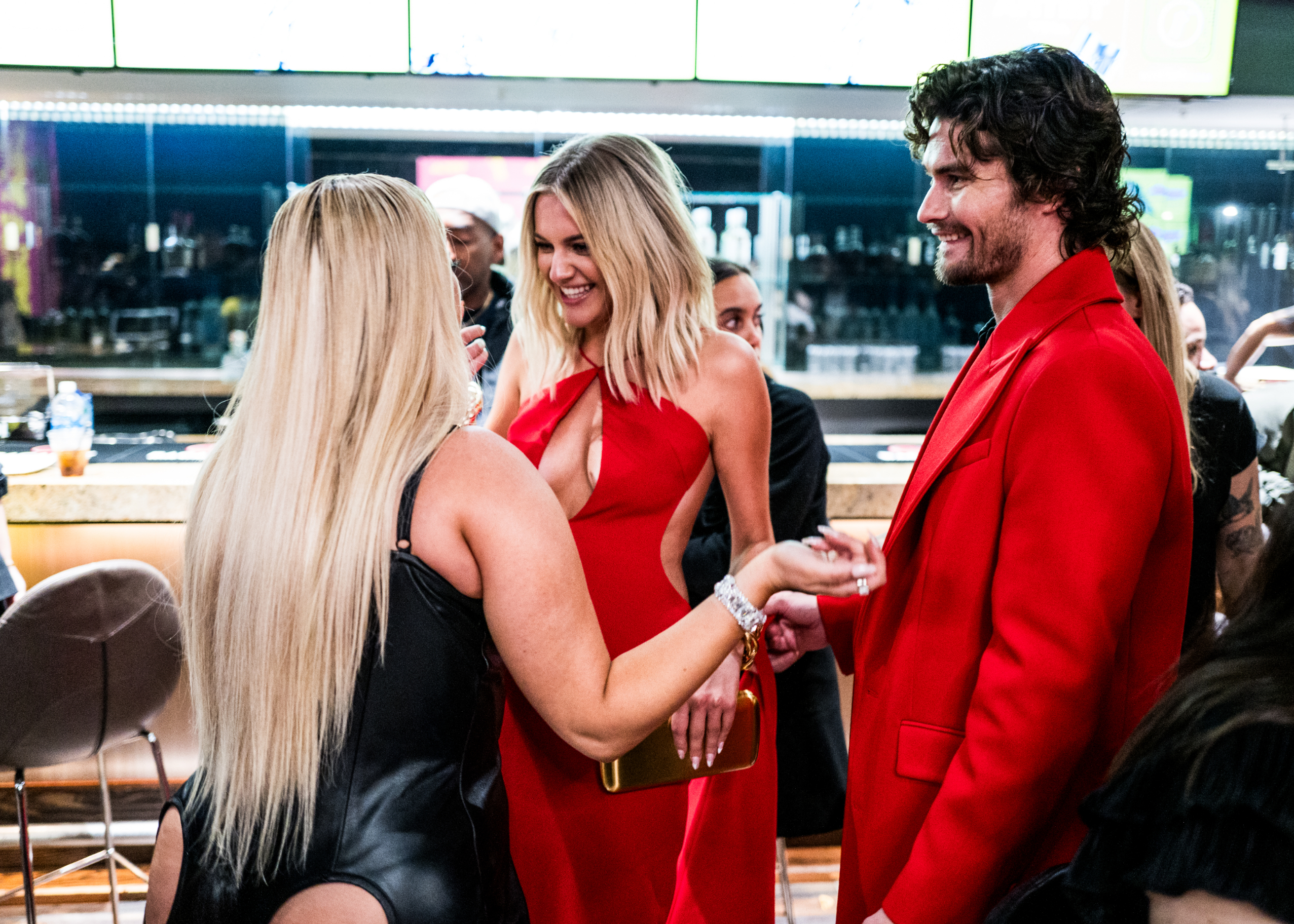 Kelsea and Chase smile at Bebe as they stand together