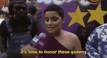 Gif of Nelly Furtado with a pixie cut saying &quot;It&#x27;s time to honor these queens.&quot;