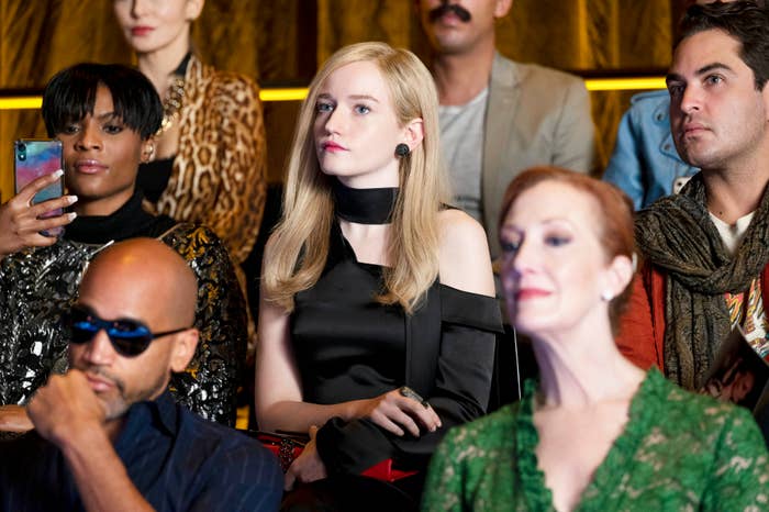 wealthy people at a fashion show