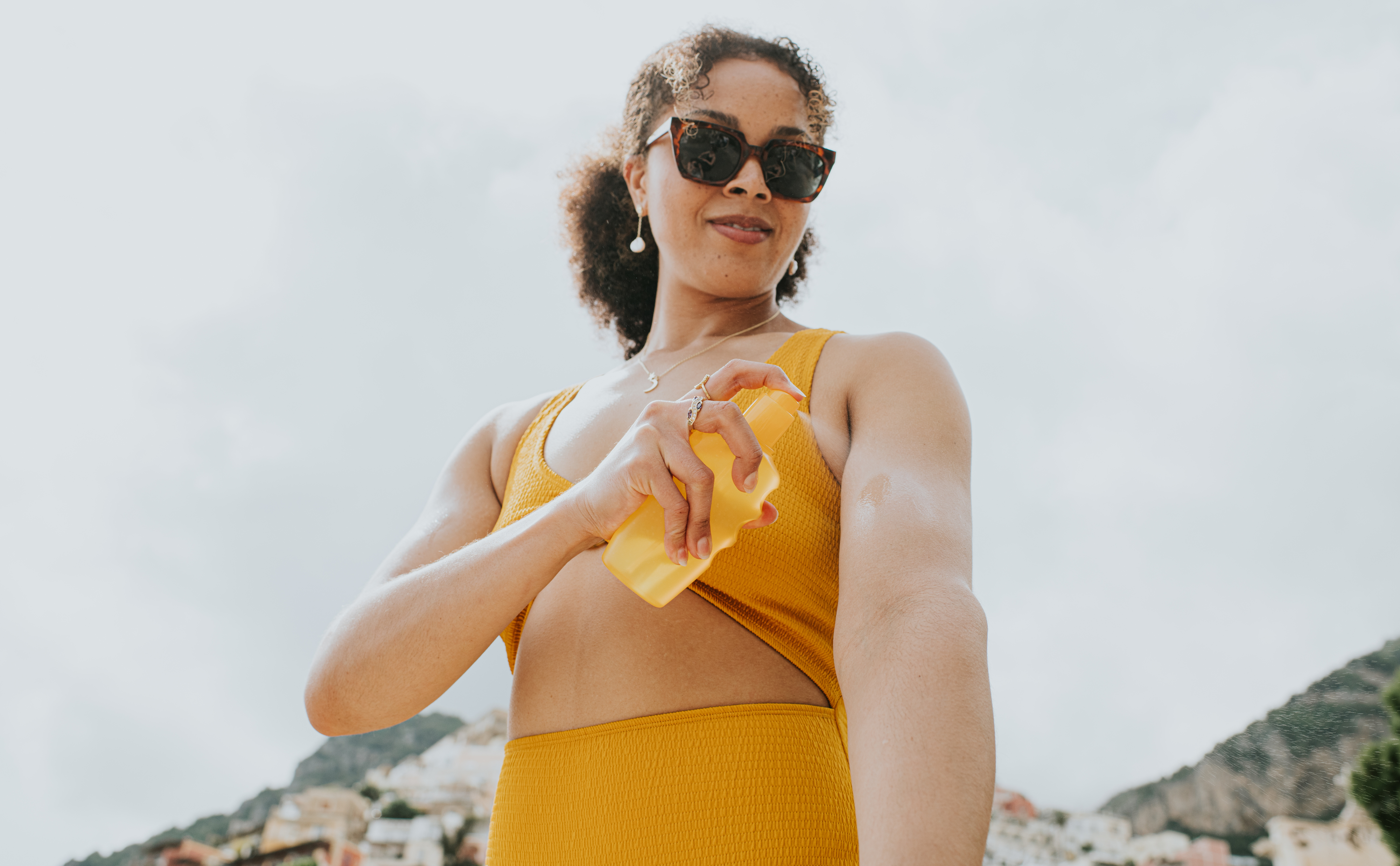 a person putting on sunscreen