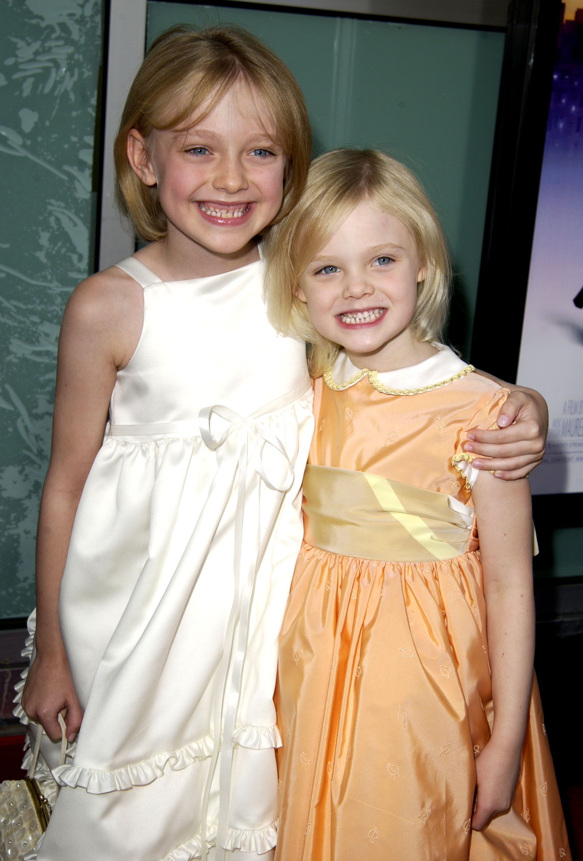 the sisters as kids at an event