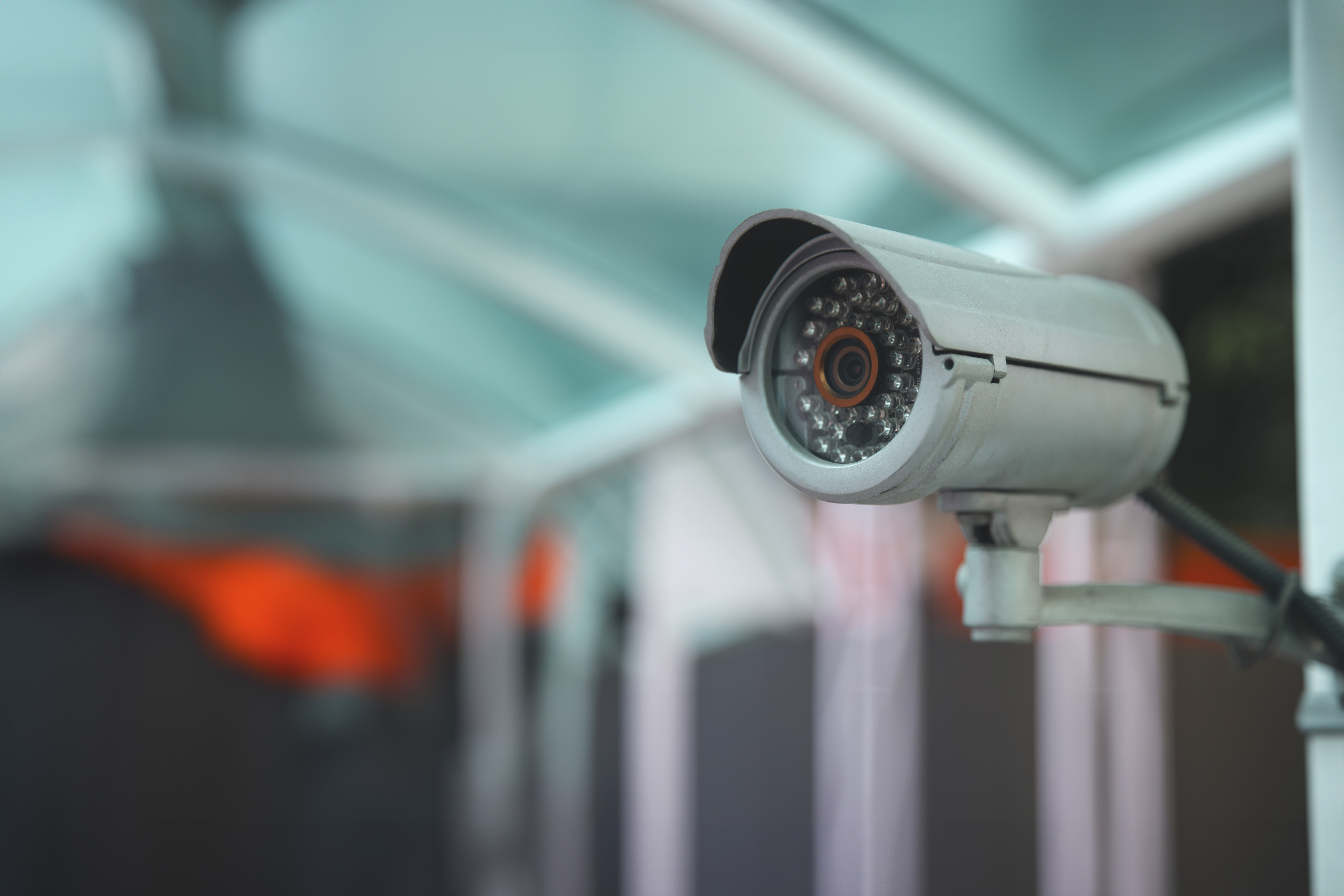 surveillance camera mounted outside of a store