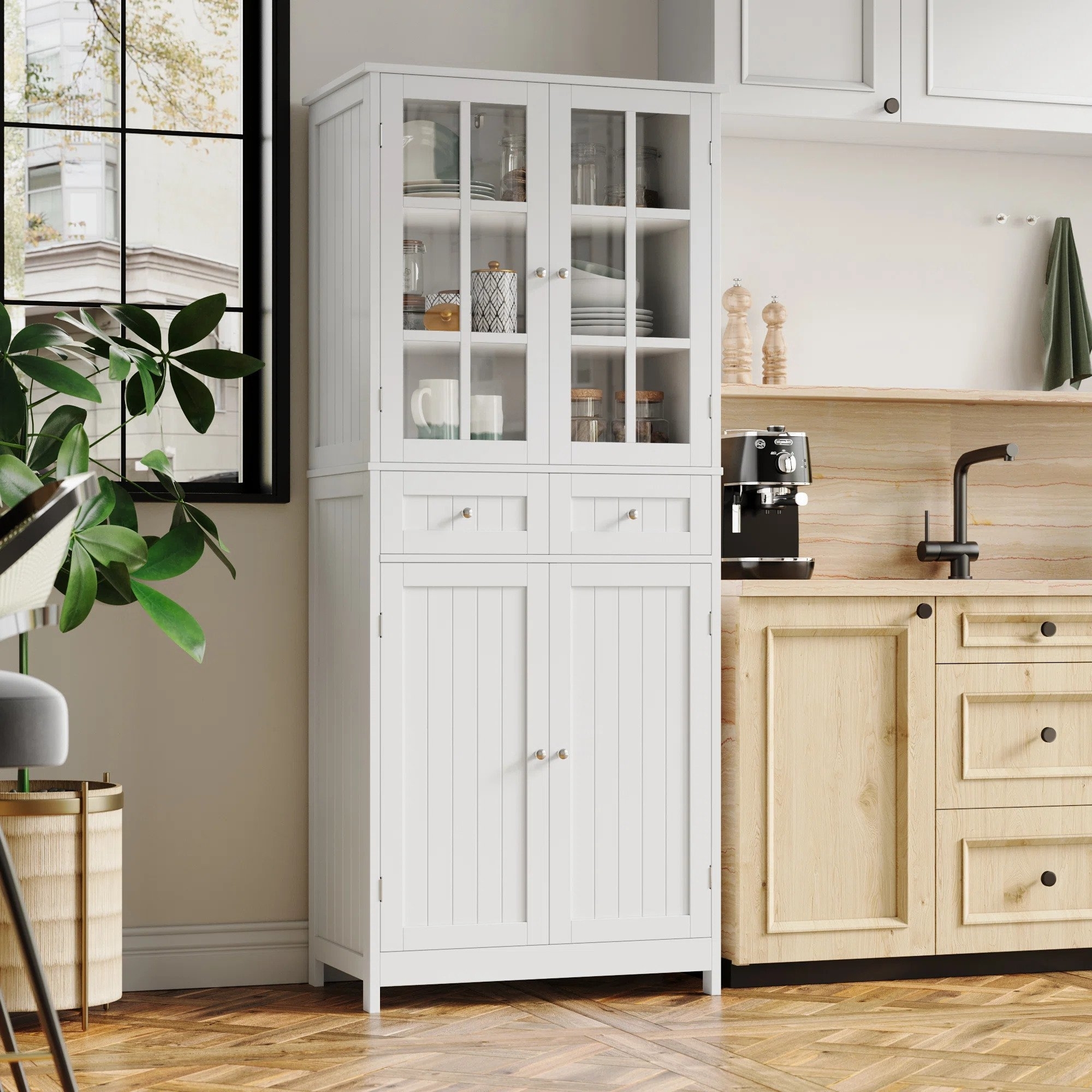 The white pantry with two cabinets and two drawers, featuring glass doors on the top half