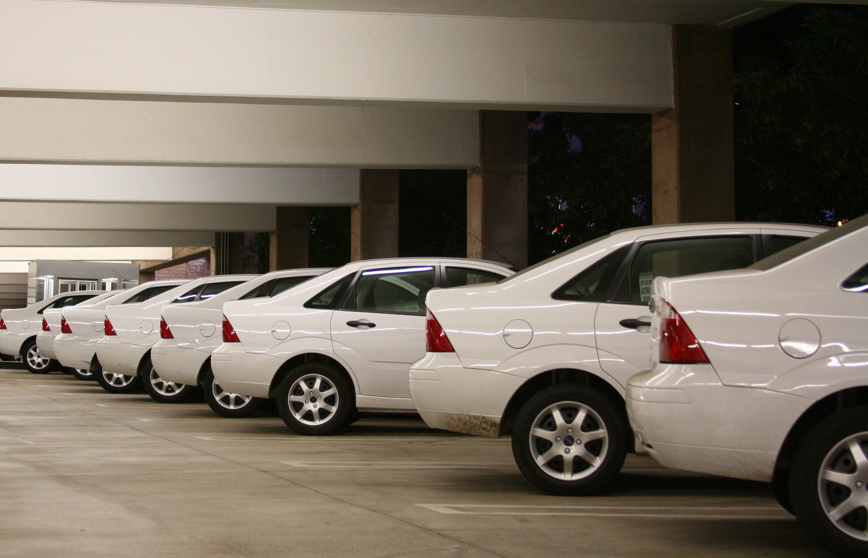 A row of white cars